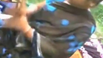 Older Indian Woman And Young Man Engage In Sexual Activity, Including Fondling Her Breasts And Vagina, Captured On Hidden Camera
