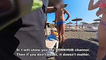 A Young Nudist Girl Engages In Sexual Activities With A Stranger On The Beach, Surrounded By Old Voyeuristic Men