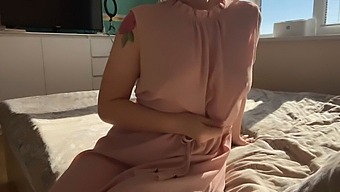 A Girl In A Pretty Pink Dress Explores Her Intimate Areas